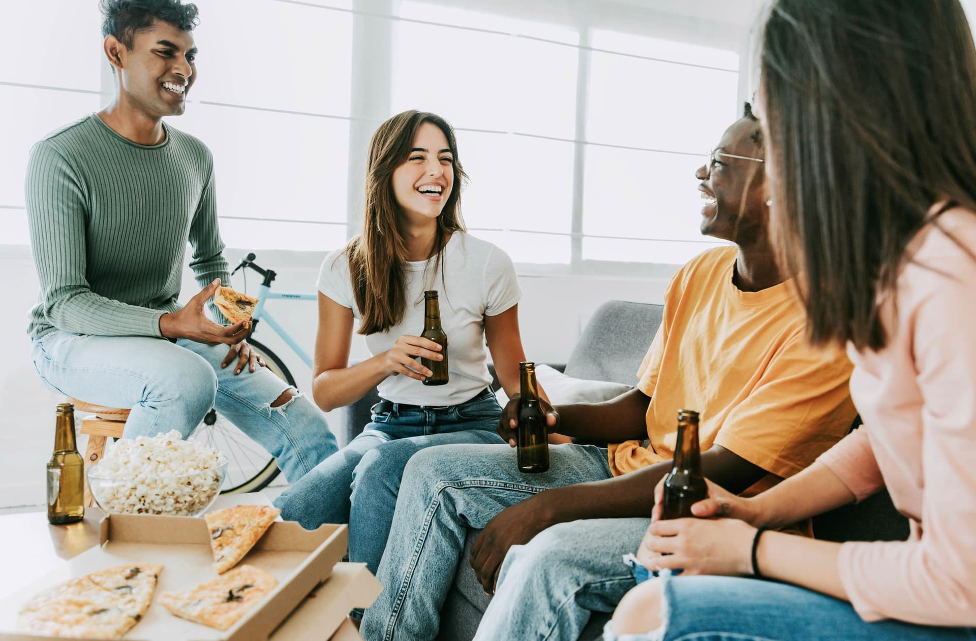 Group of friends eating pizza